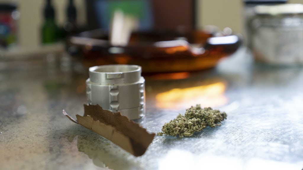 Filling a blunt with weed