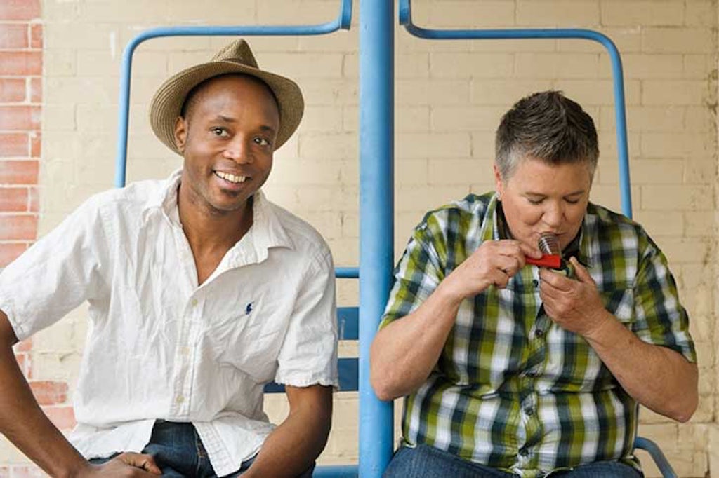 Man and woman smoke from a pipe