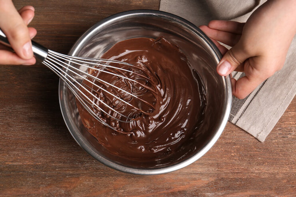 Whisking chocolate cake dough