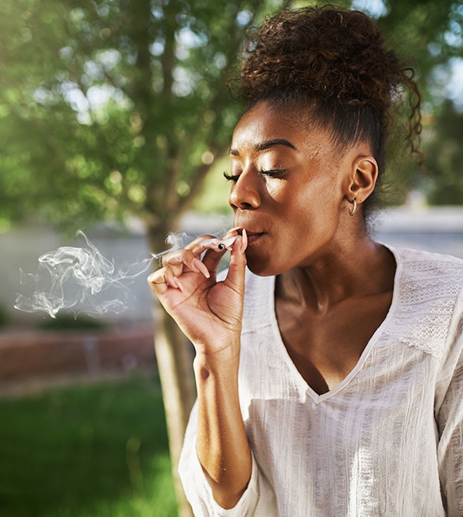 A woman smoking cannabis